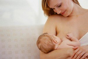 Woman Breastfeeding Baby